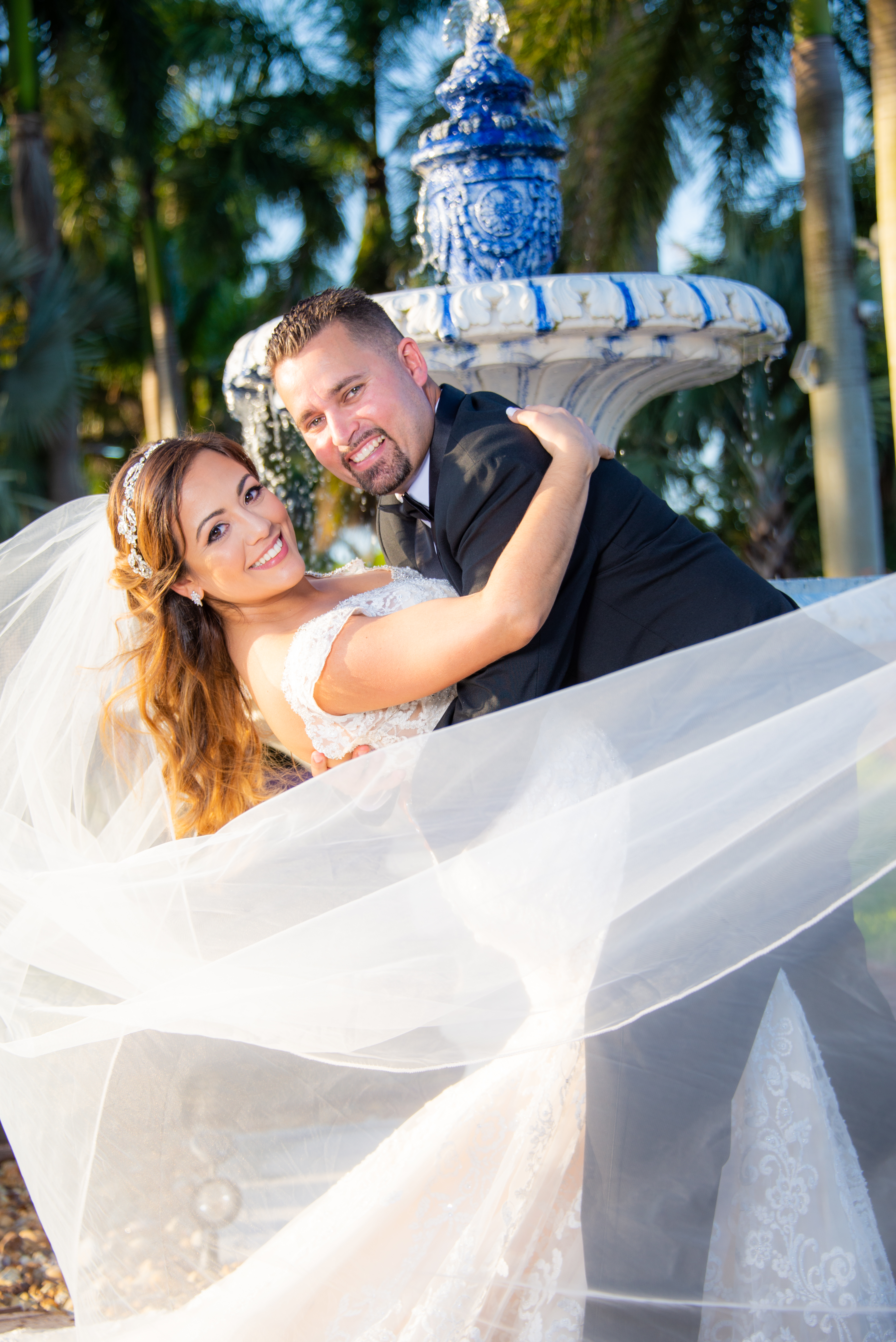 Wedding couple in front of open gates