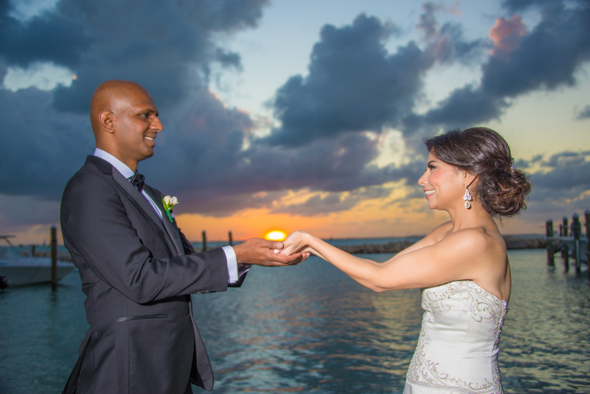 bride groom wedding holding sun sunset